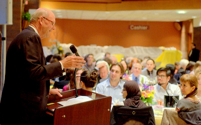 a person speaking to a group of people