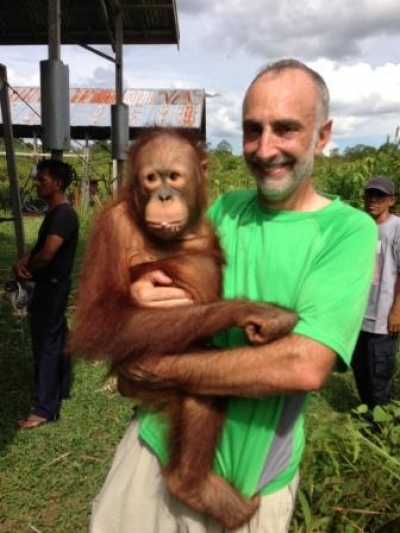 a man holding a monkey