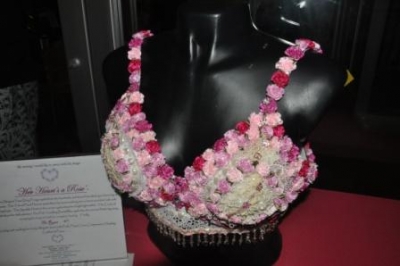 A bra made out of pink, red, and white roses