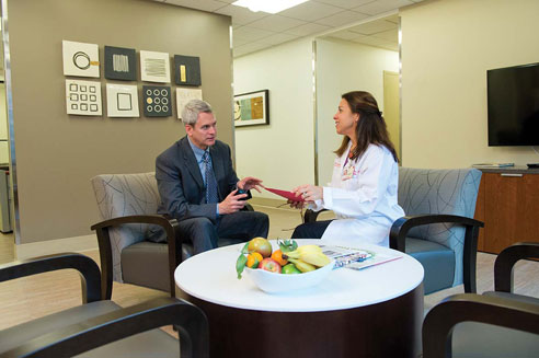 a patient talks with Wanda See, DNP, ANP-BC, at the Executive Health program at New York Presbyterian