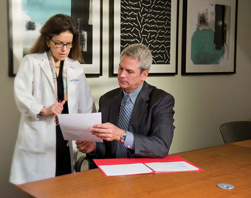 Orli Etingin, M.D., consults with a patient in the Executive Health program at New York Presbyterian