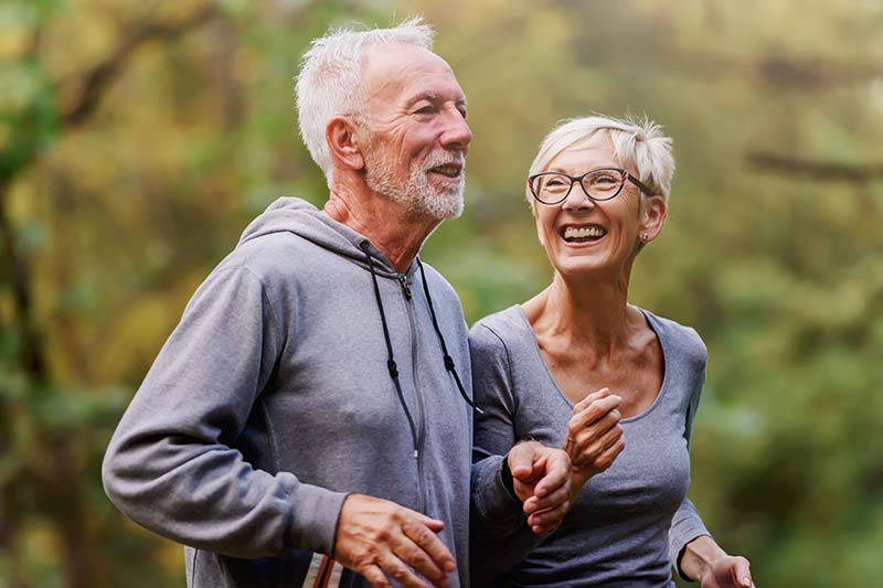 image of older couple jogging next to each other