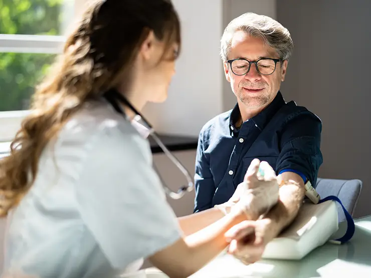 image of nurse taking man's blood pressure