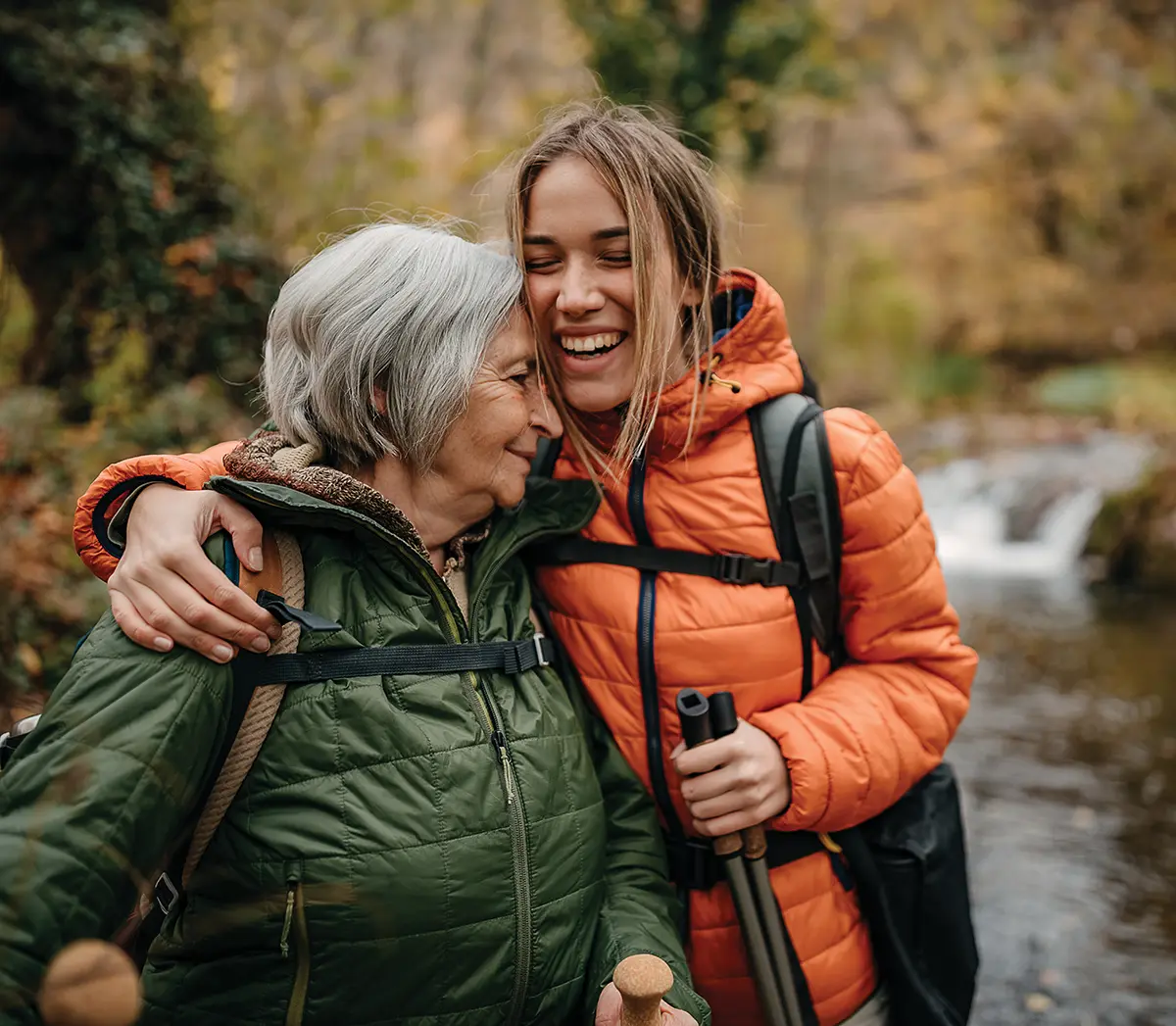 an elderly woman with a young one, hiking