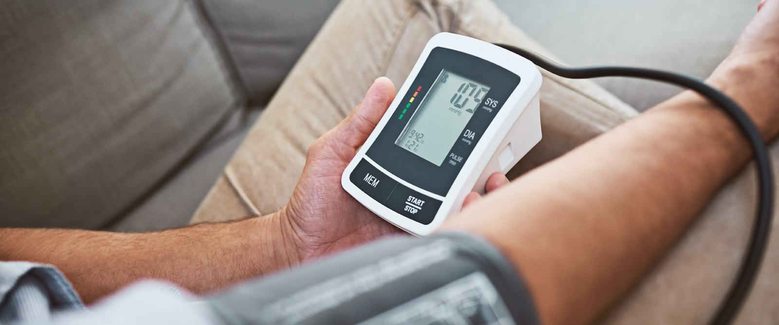 Person taking blood pressure reading