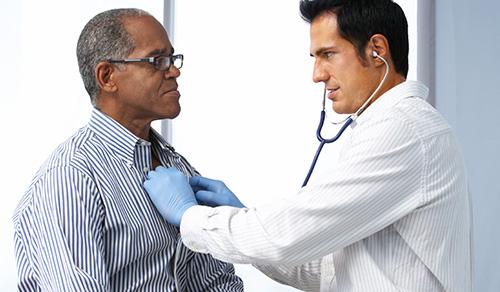Doctor during appointment with patient Doctor during appointment with patient